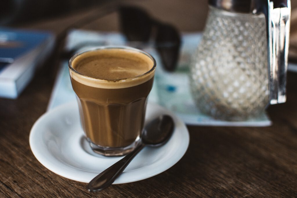 foodiesfeed.com coffee cortado in a glass cup