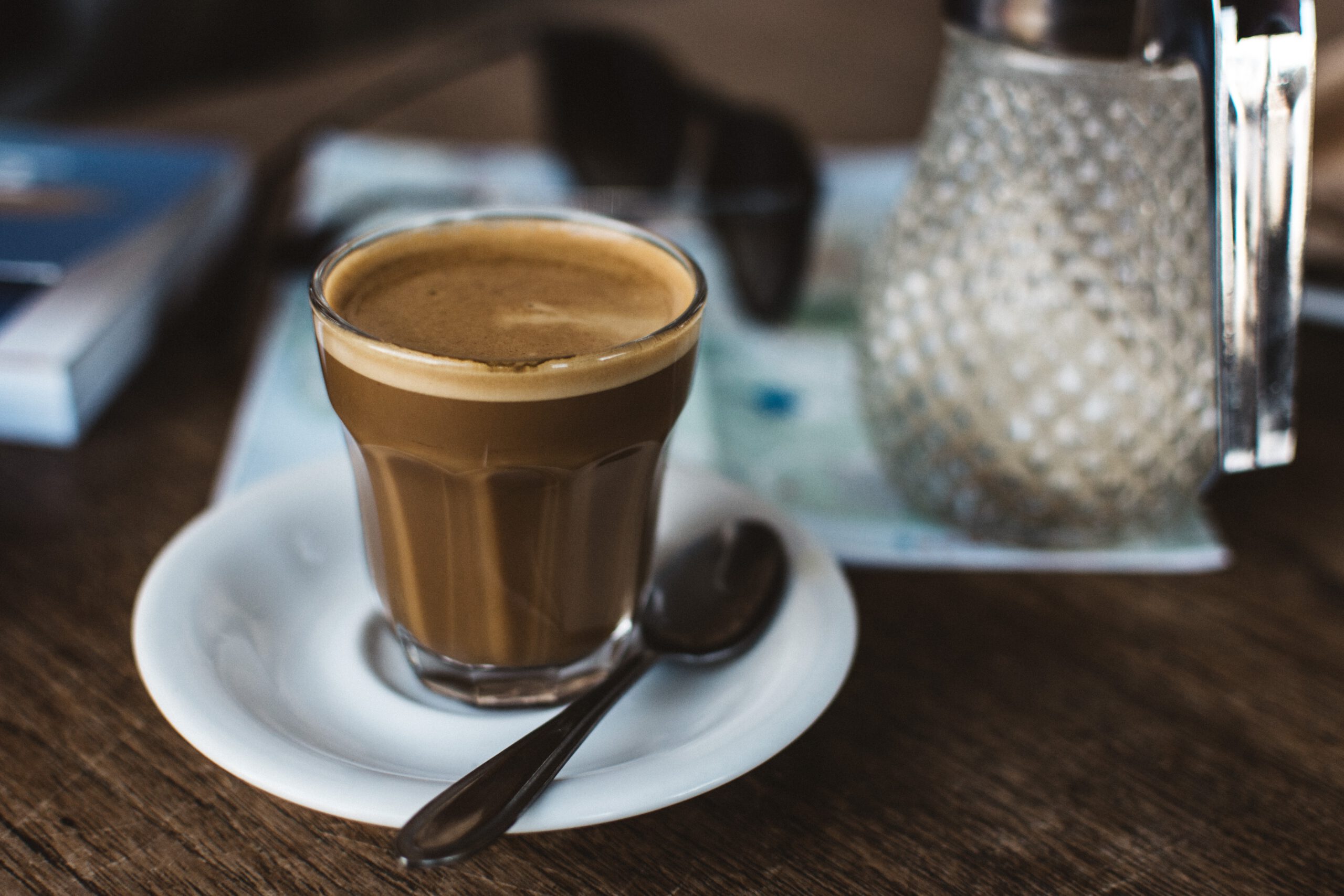 foodiesfeed.com coffee cortado in a glass cup